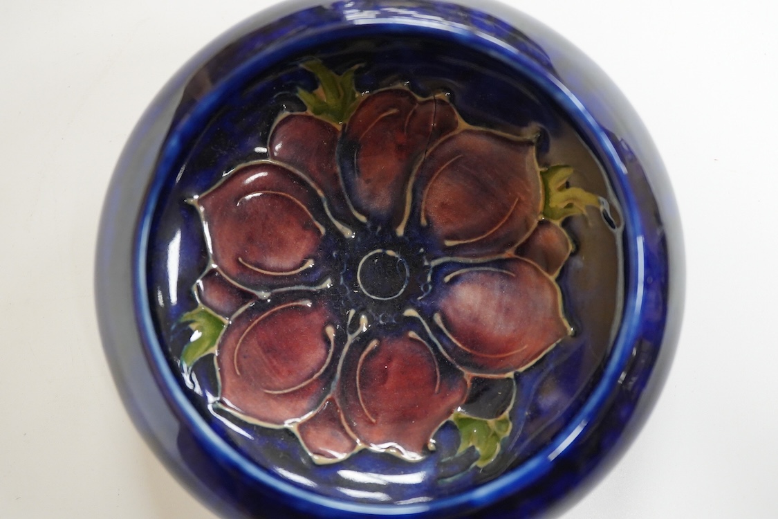 A small Moorcroft bowl in the anemone pattern, stamped to the base, 11cm in diameter